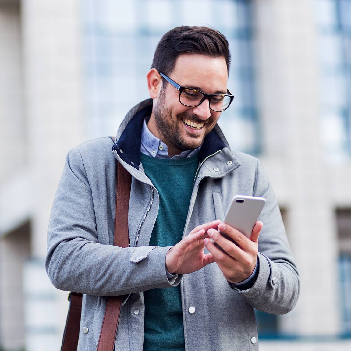 man using phone outside