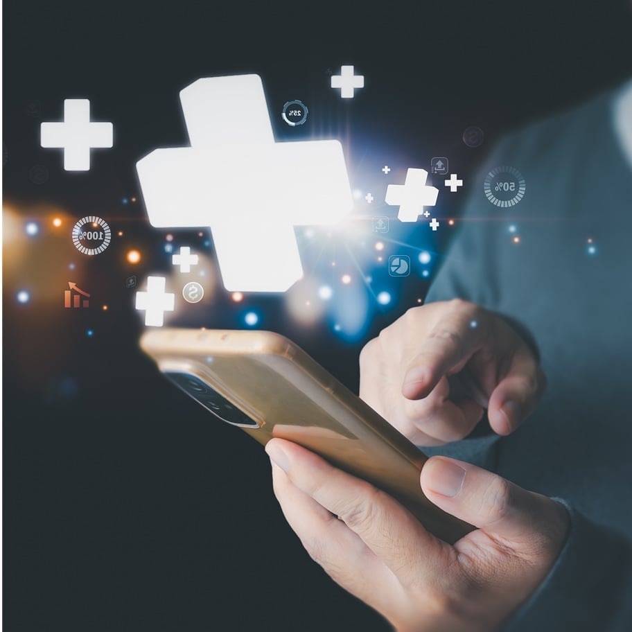 phone in hand with health symbols floating above